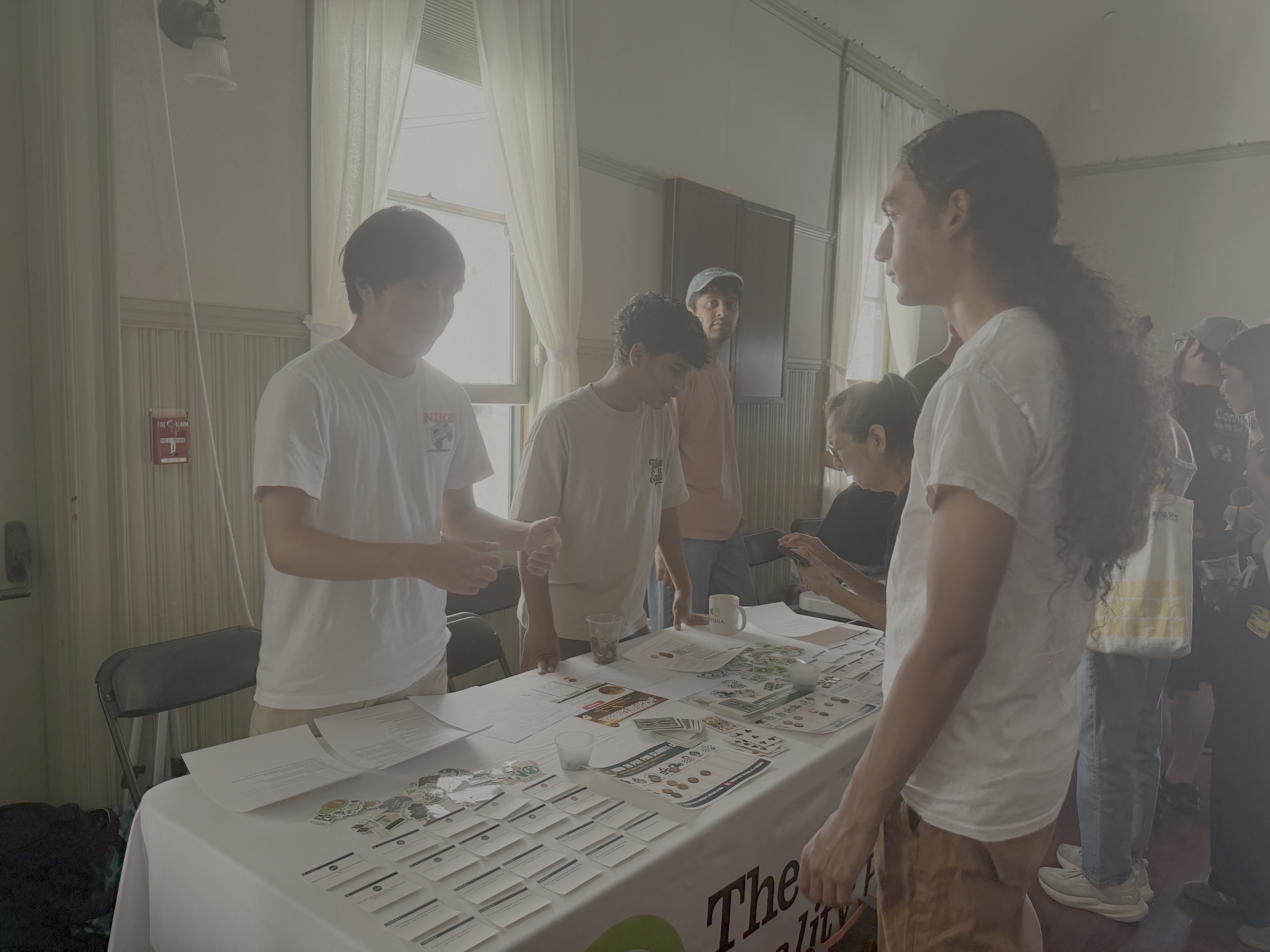 IRISTEM students sharing environmental resources at a community event